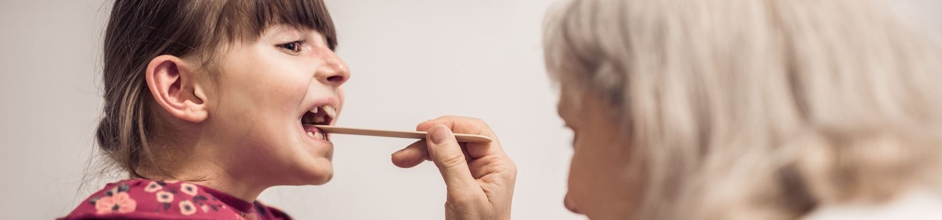 Physician at the EB House examining a child living with EB