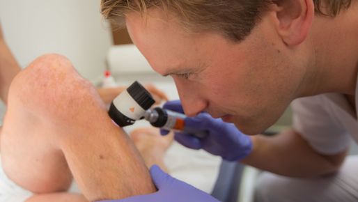 Physician examines a patient