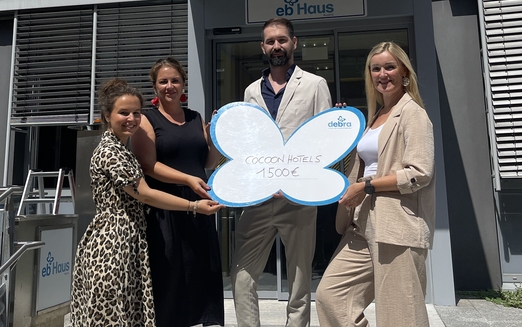 Cocoon Hotels Team bei Spendenübergabe im EB-Haus Austria